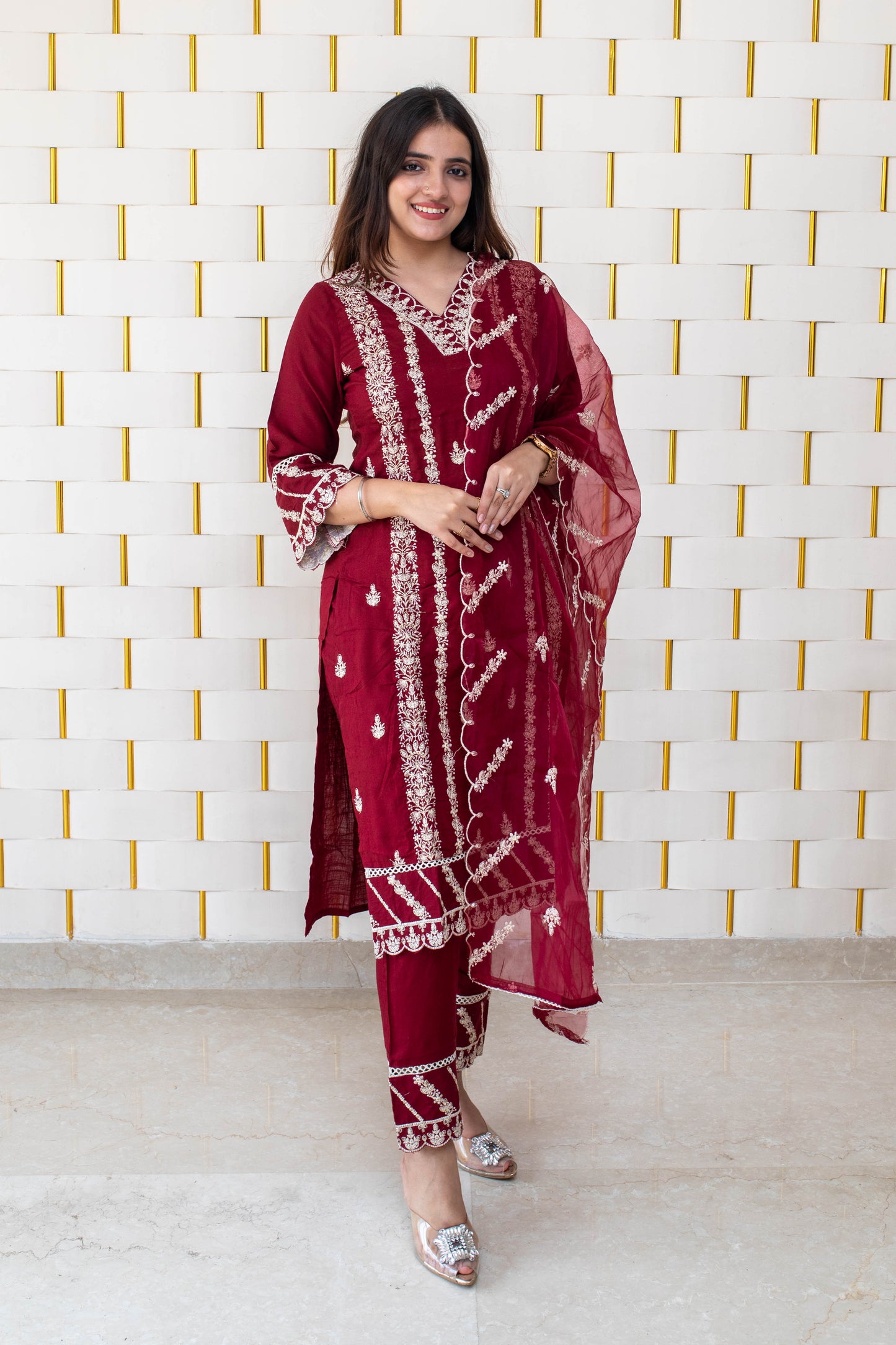 Maroon suit with all over white kadhai work with with net dupatta