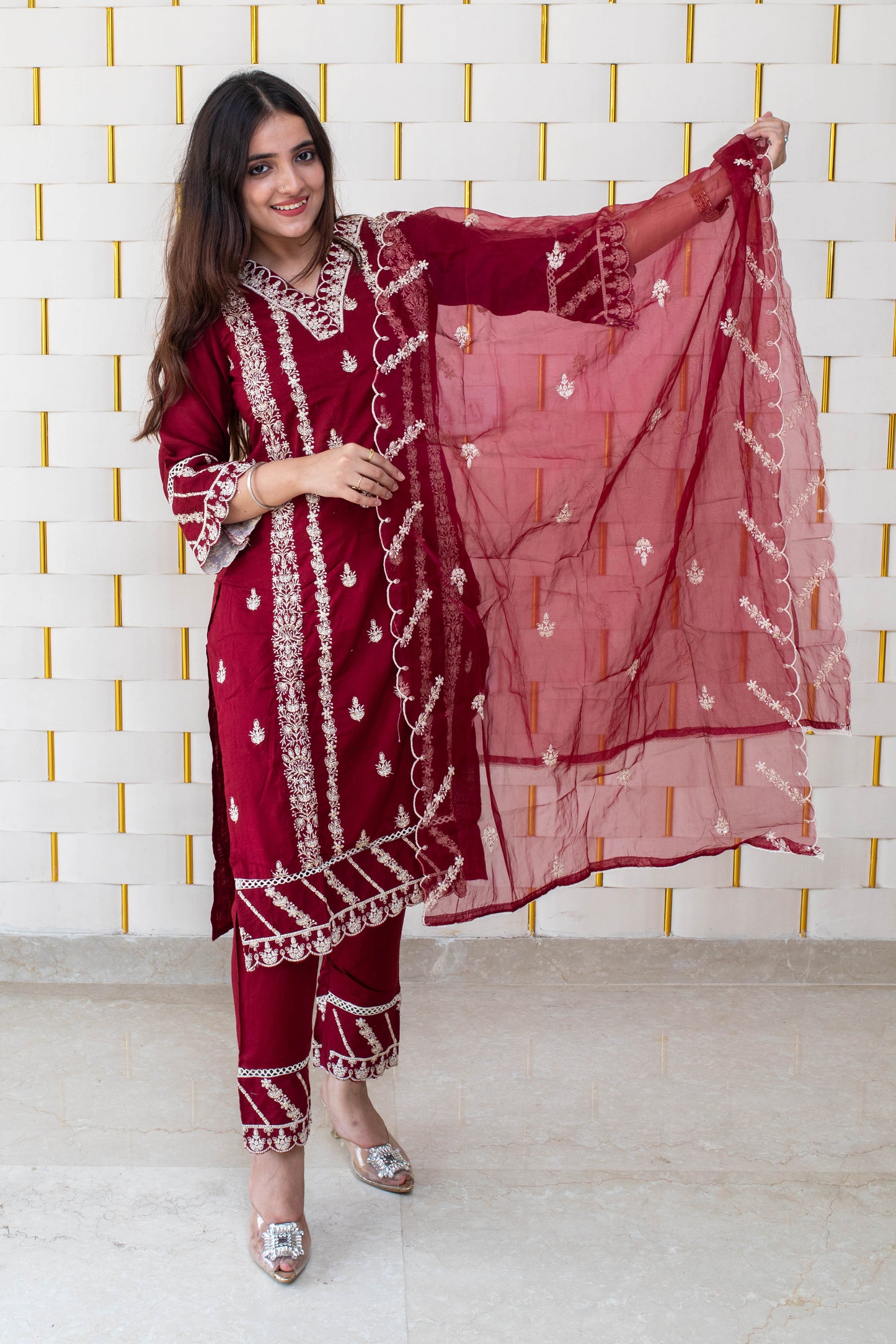 Maroon suit with all over white kadhai work with with net dupatta