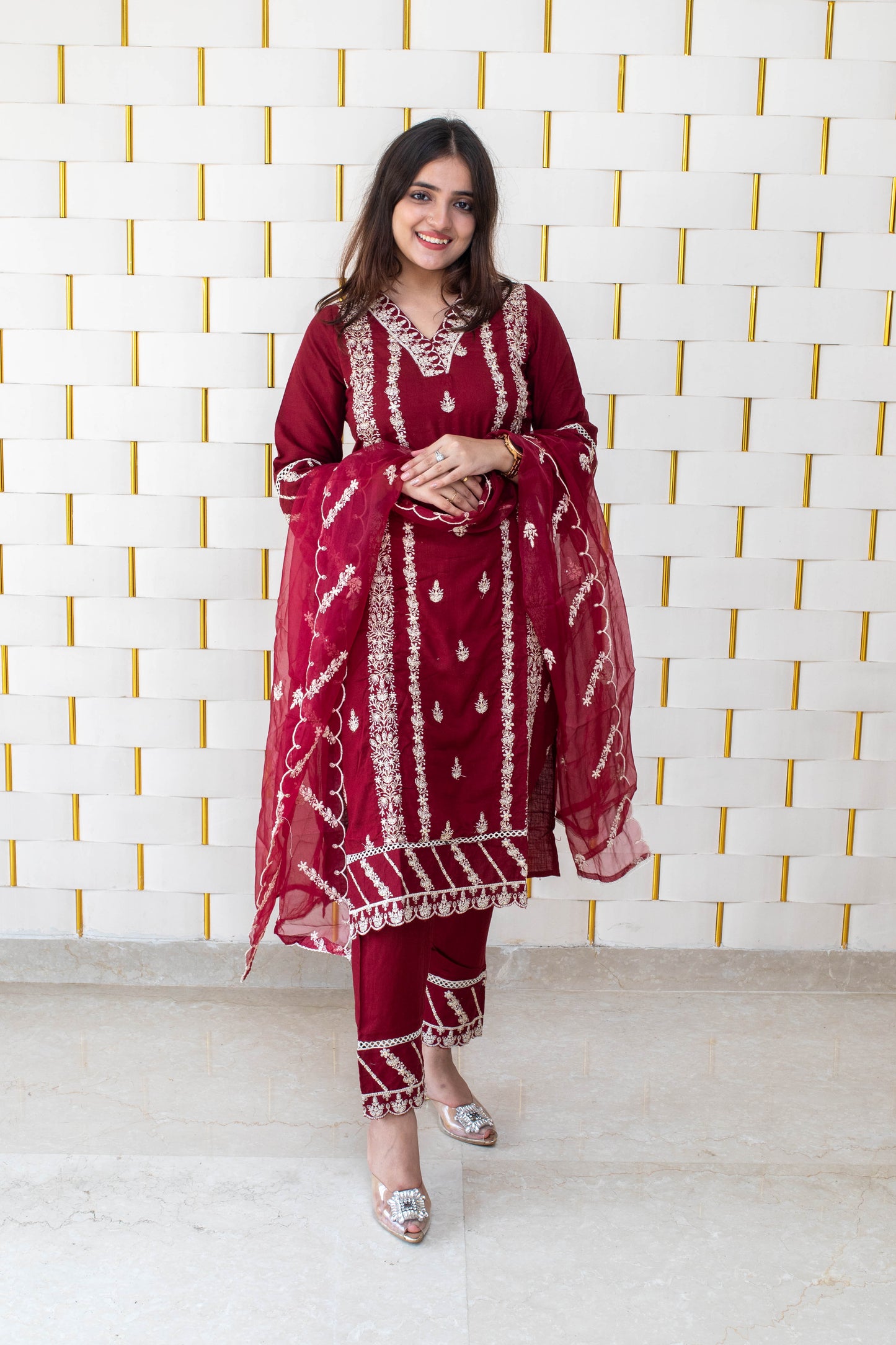Maroon suit with all over white kadhai work with with net dupatta