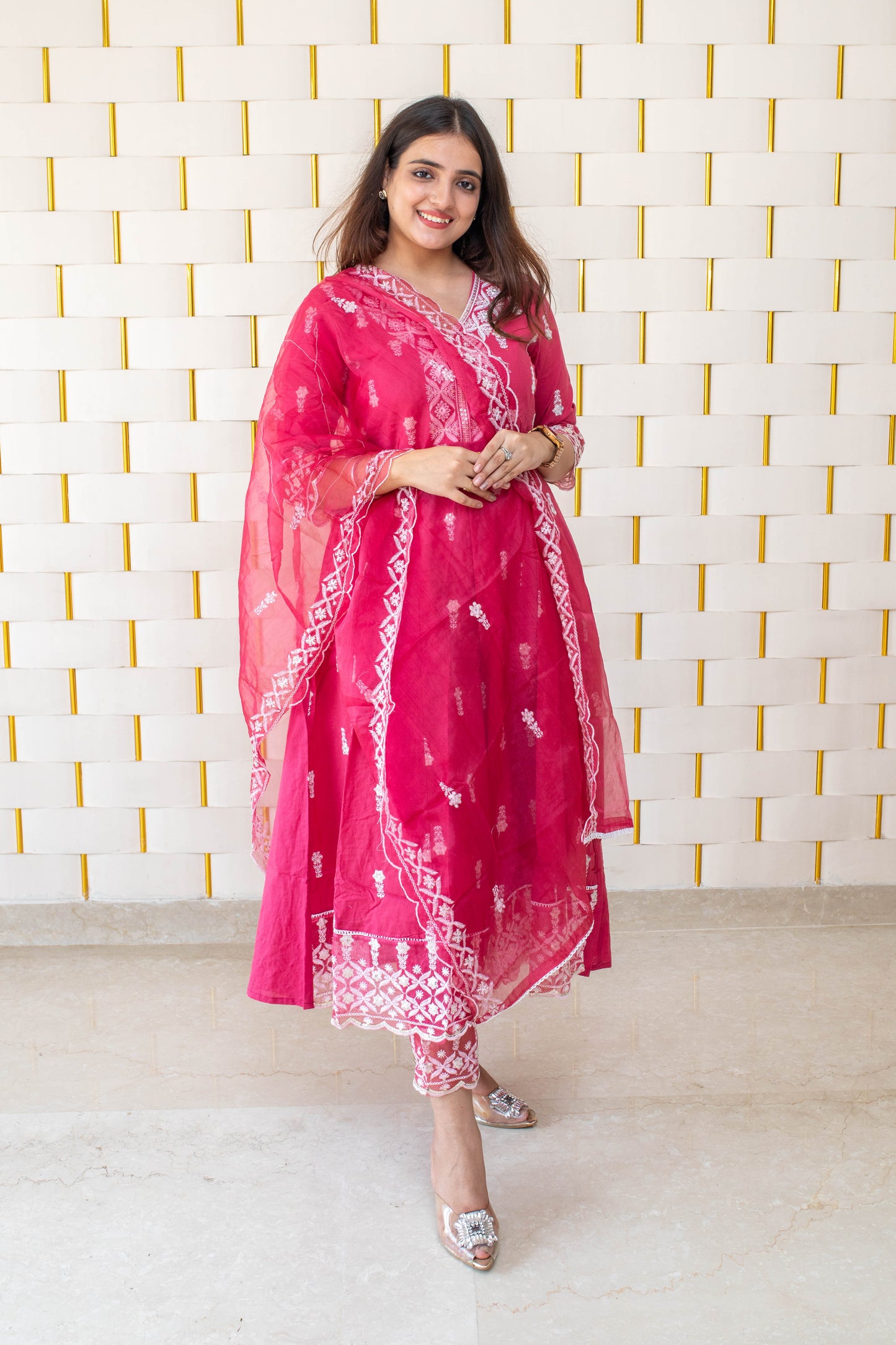 Pink Anarkali suit with white kadhai, net lace on borders and net dupatta
