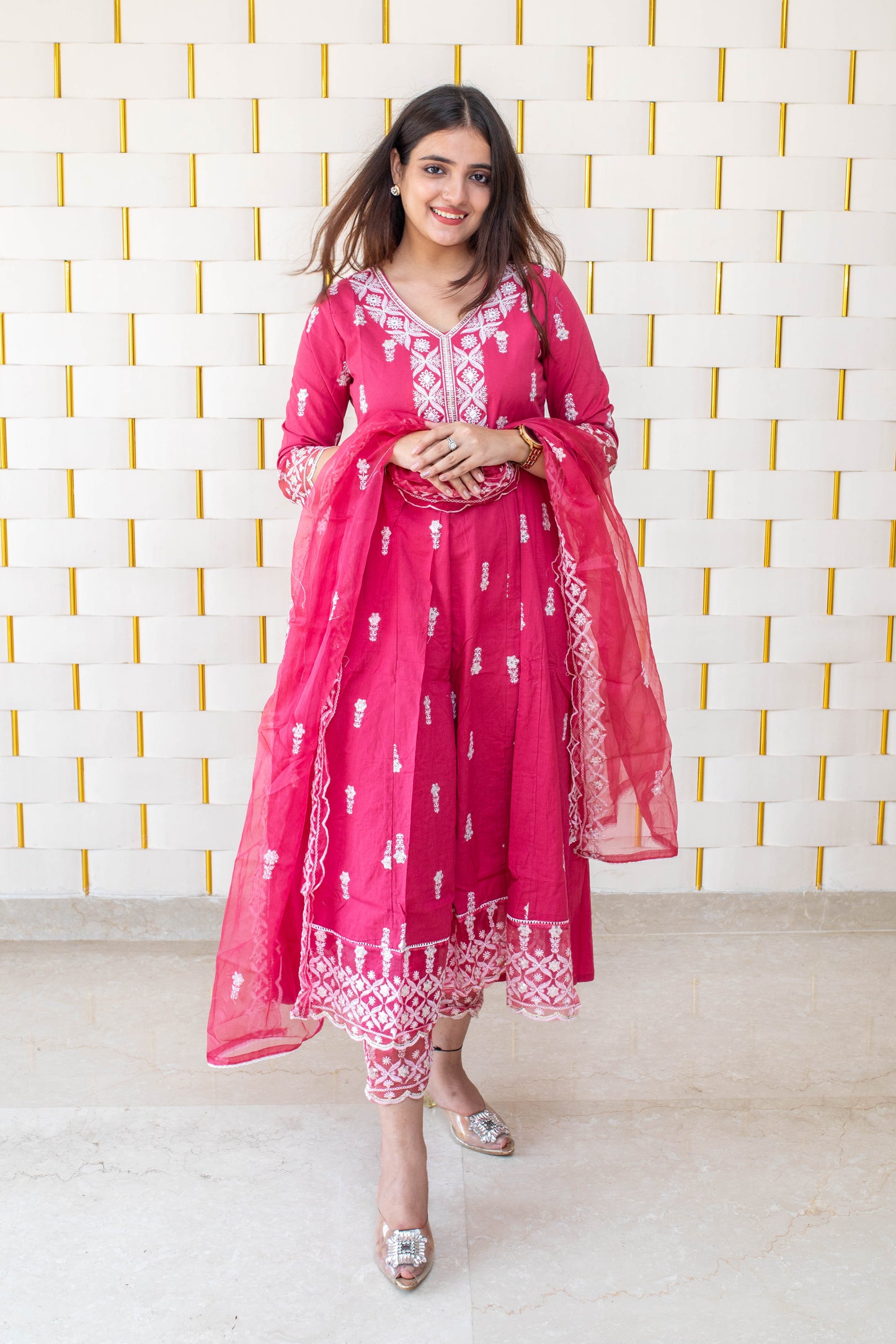 Pink Anarkali suit with white kadhai, net lace on borders and net dupatta