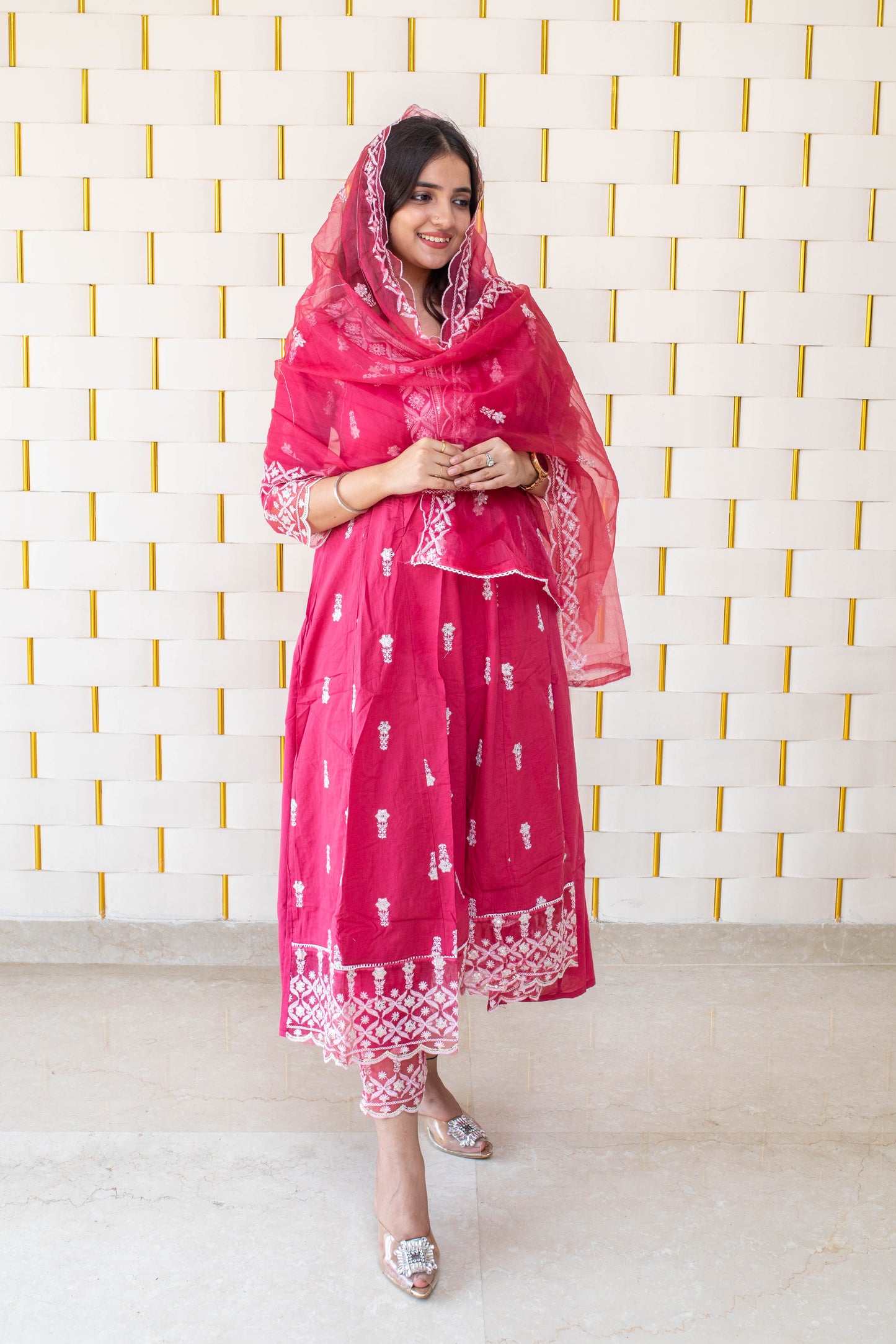 Pink Anarkali suit with white kadhai, net lace on borders and net dupatta