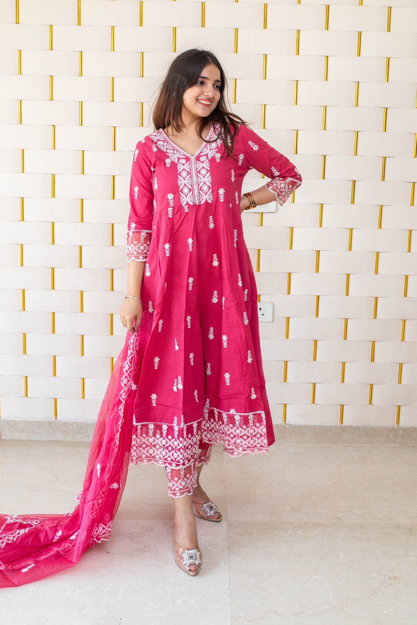 Pink Anarkali suit with white kadhai, net lace on borders and net dupatta