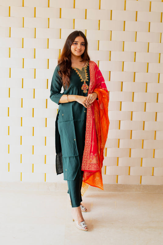 Green Suit paired with a vibrant Silky Orange Dupatta