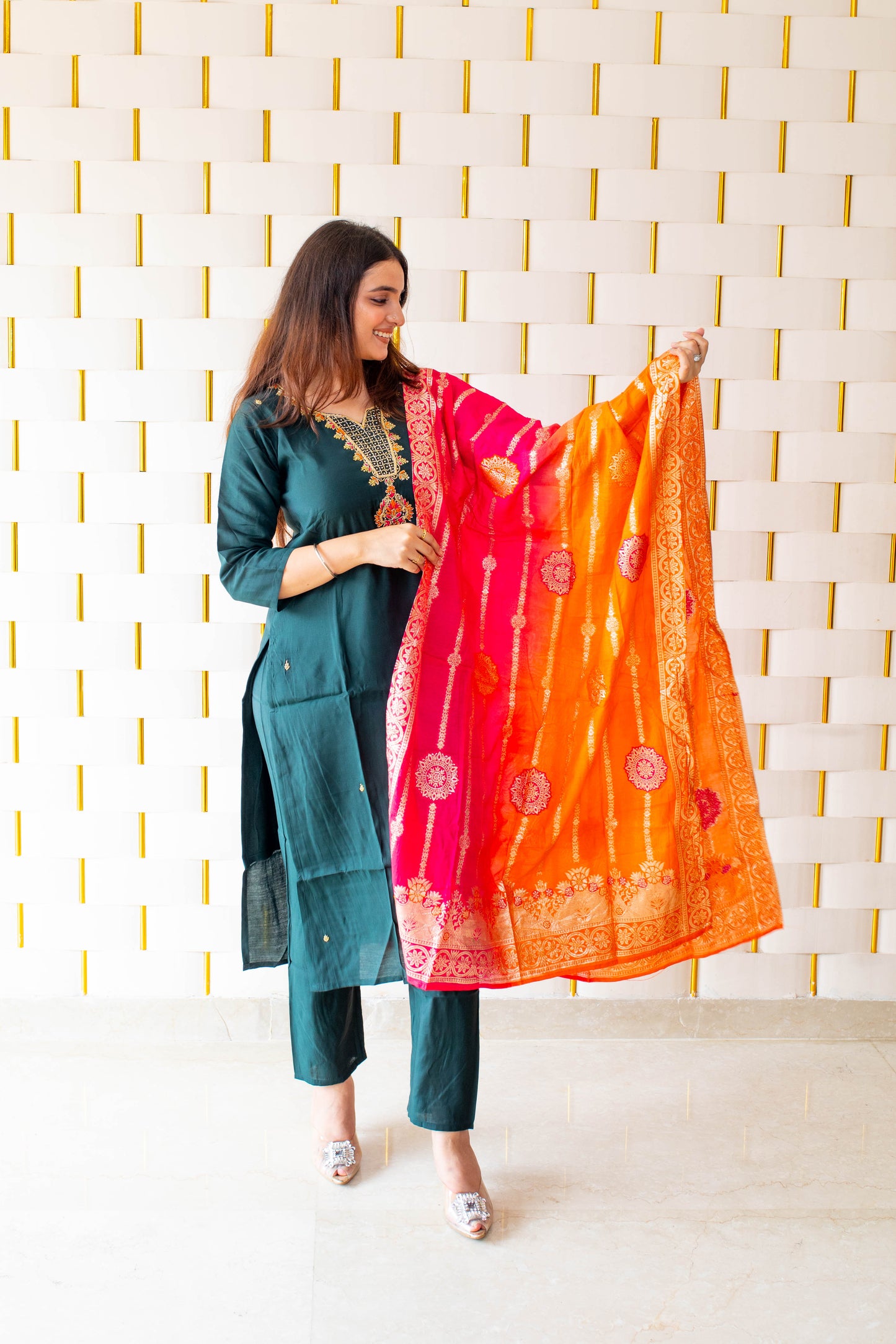 Green Suit paired with a vibrant Silky Orange Dupatta
