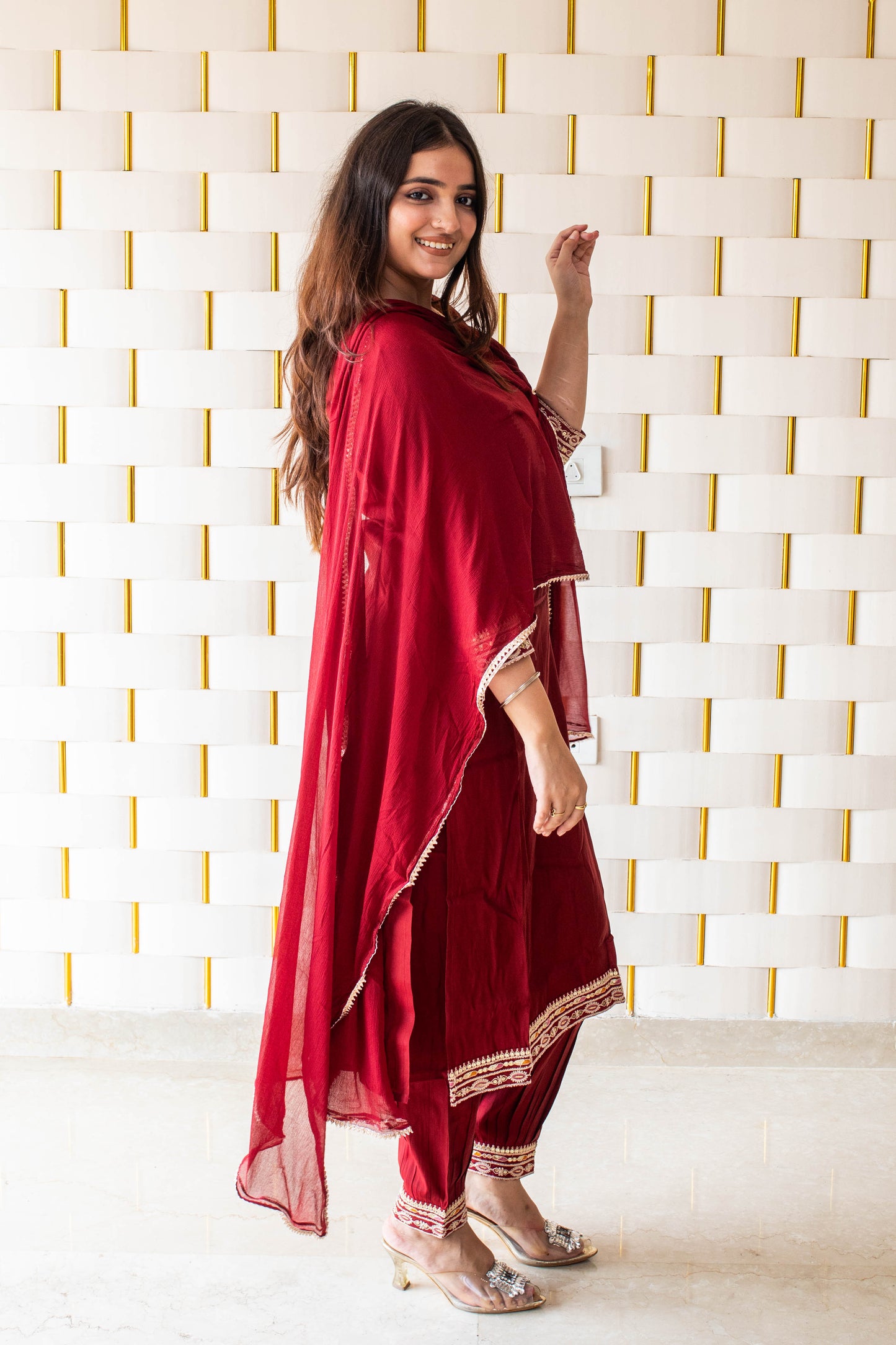 Maroon Suit with kadhai work on neck, sleeves and borders