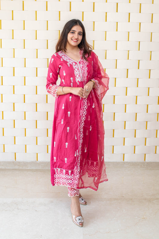 Pink Anarkali suit with white kadhai, net lace on borders and net dupatta