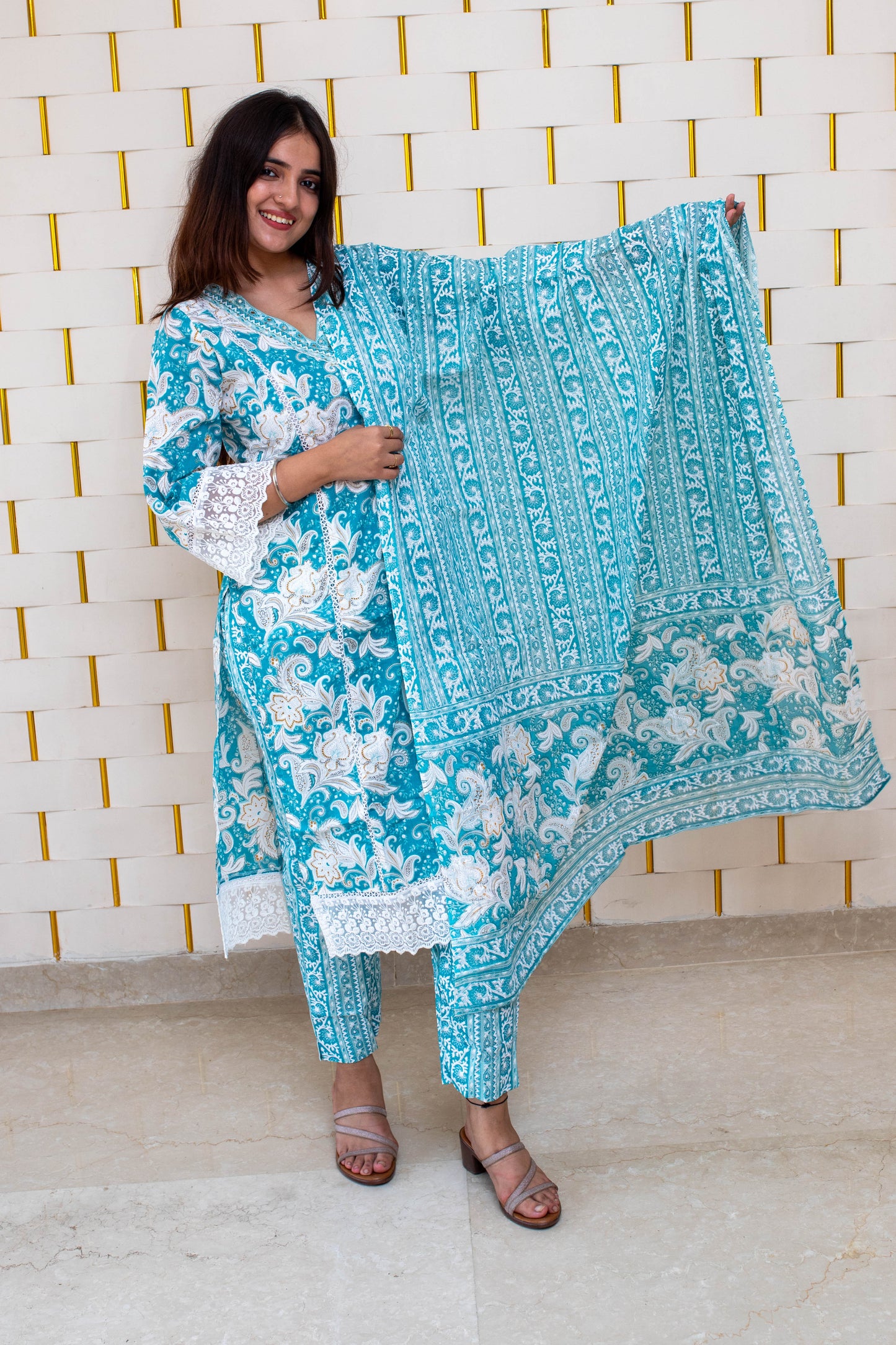 Light Blue (Firozi) Floral Suit with minor Embroidery work on Neck and Net work on Sleeves and Dupatta