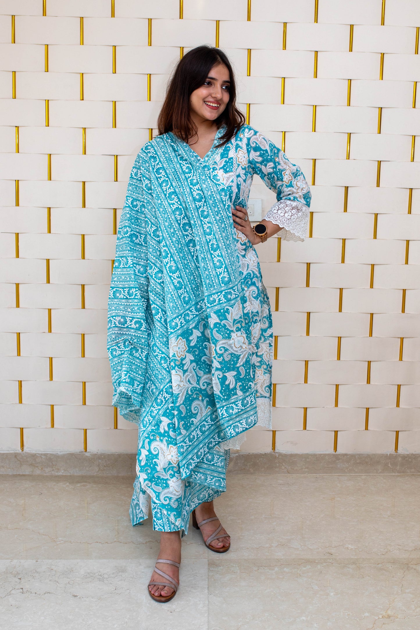 Light Blue (Firozi) Floral Suit with minor Embroidery work on Neck and Net work on Sleeves and Dupatta