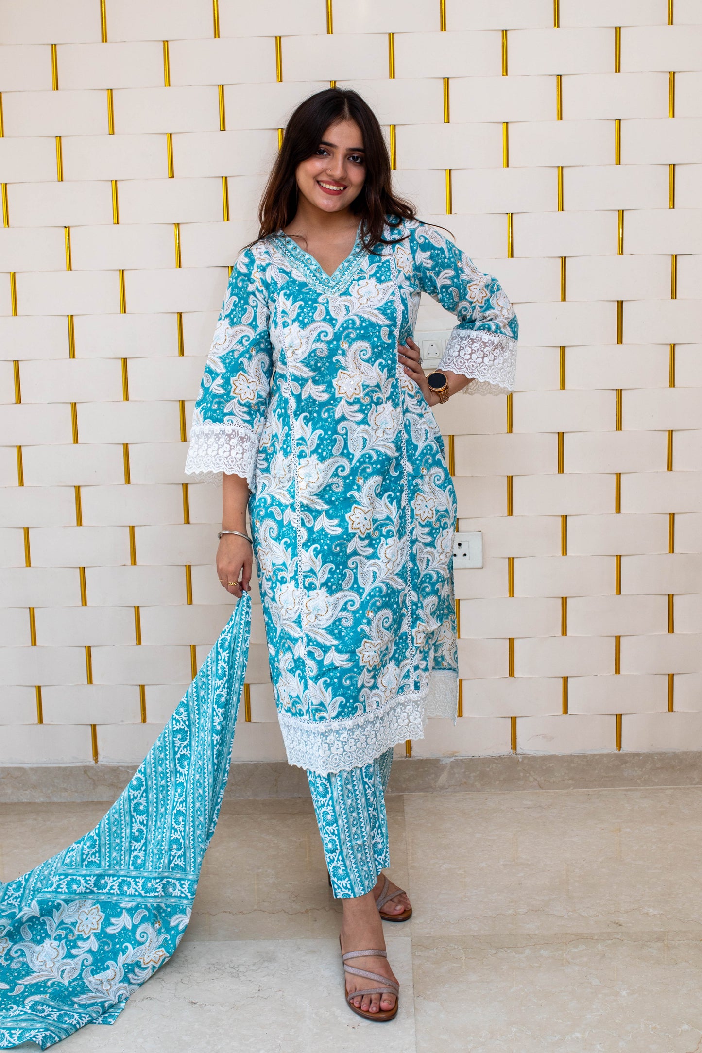Light Blue (Firozi) Floral Suit with minor Embroidery work on Neck and Net work on Sleeves and Dupatta
