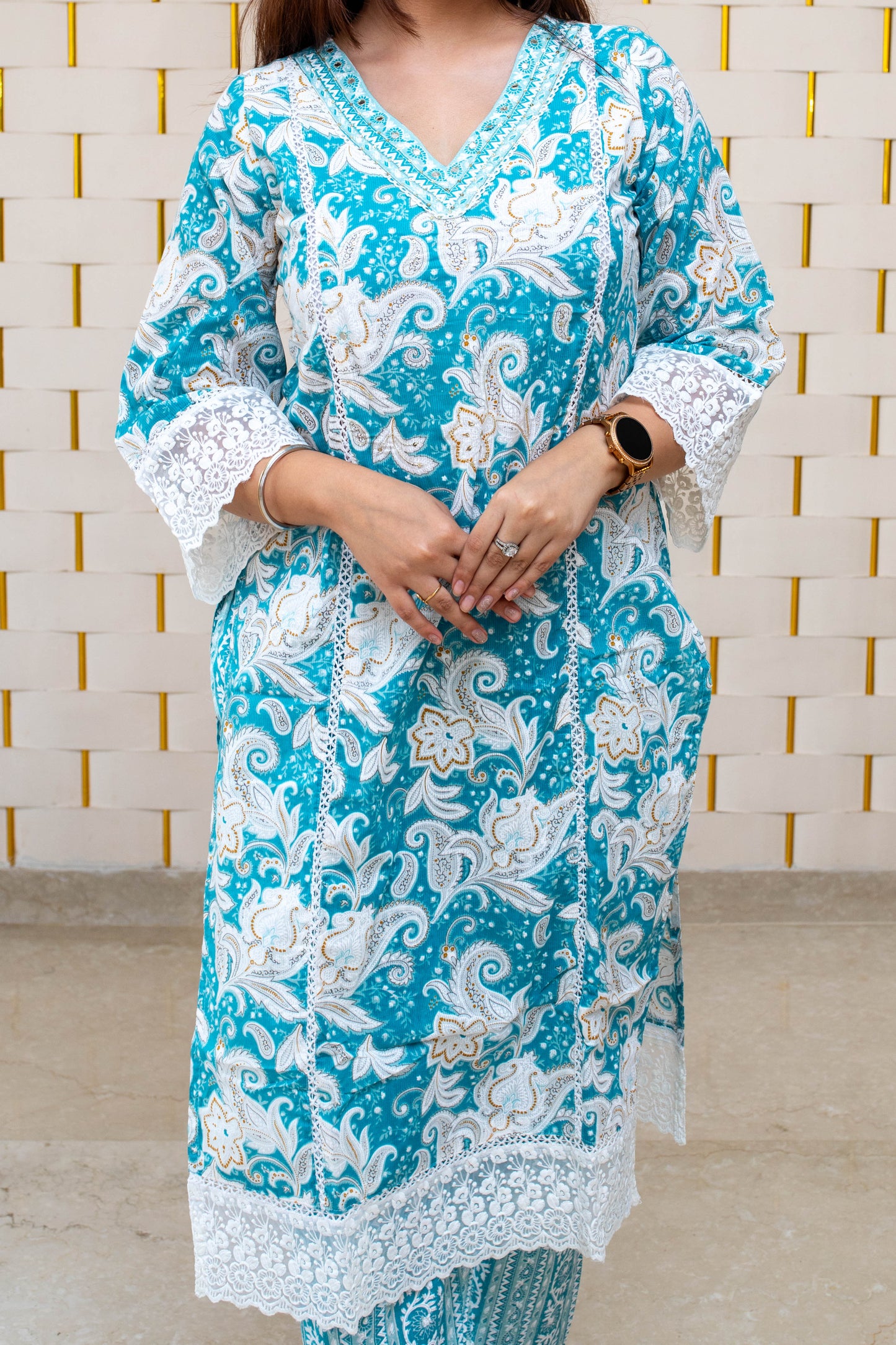 Light Blue (Firozi) Floral Suit with minor Embroidery work on Neck and Net work on Sleeves and Dupatta